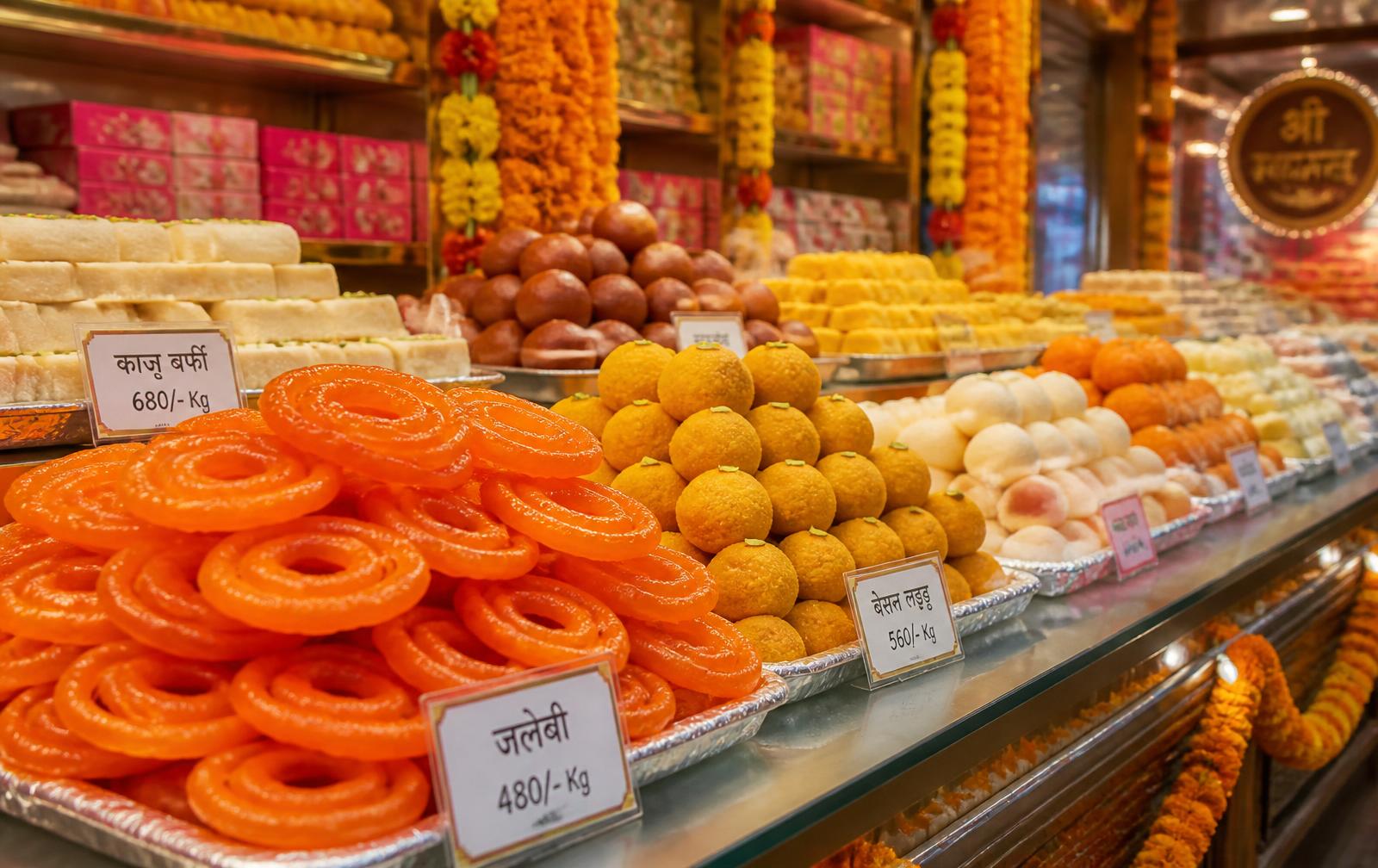 Counter full of freshly made Indian sweets at Aarohi Sweets